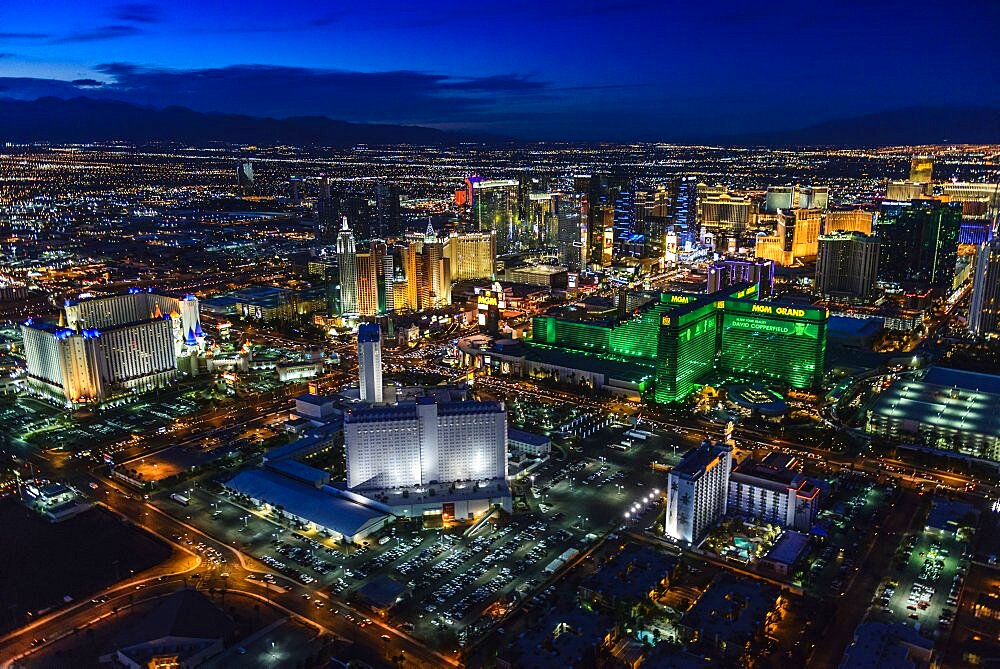 Aerial view of the city of Las Vegas at dusk, city lights and tall buildings of the travel destination.