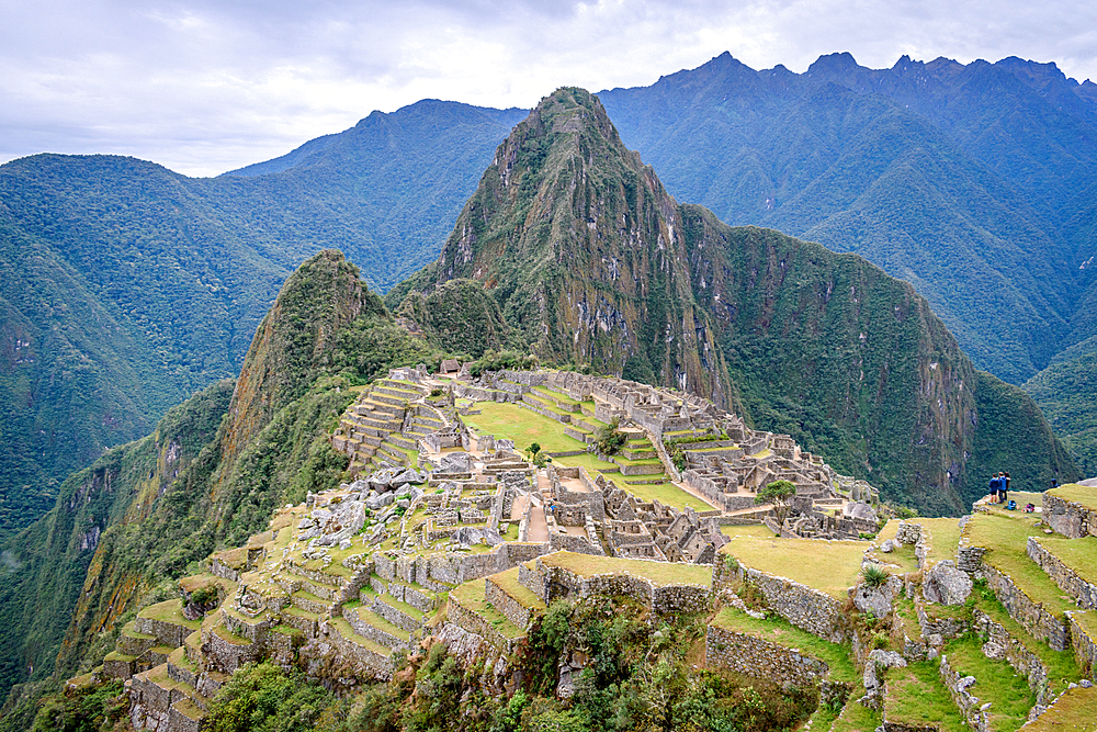 The path to Machu Picchu, the high mountain capital of the Inca tribe, a 15th century citadel site, buildings and view of the plateau and Andes mountains.