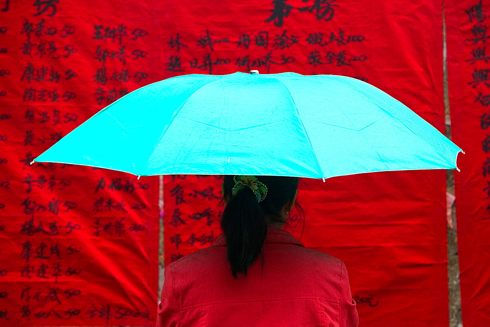 Woman under umbrella, China, China