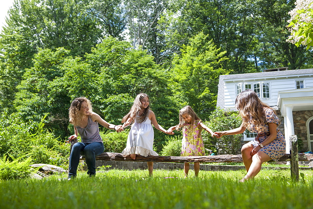 Family playing in the garden in summer.