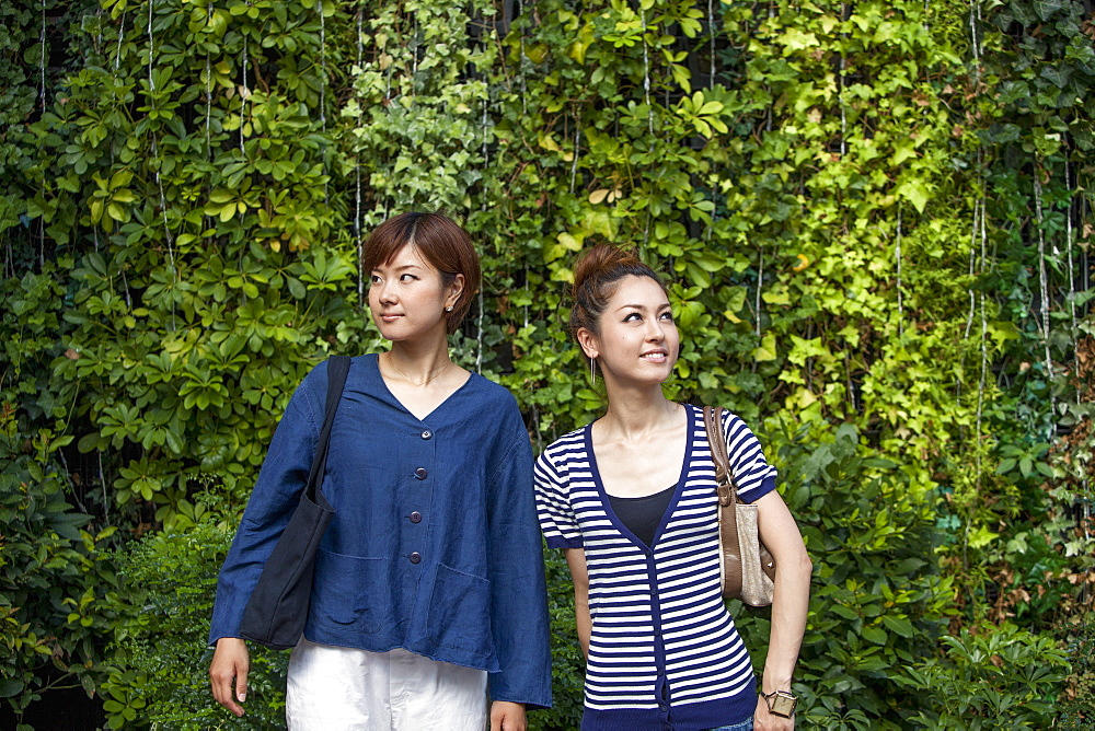 Two women standing side by side, Osaka, Japan