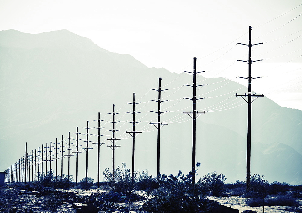 Power lines reaching into the distance, with a mountain backdrop, Hydro Lines, USA