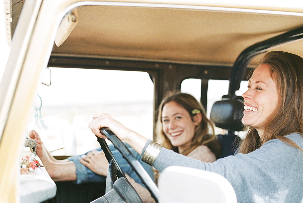 Two women on an outing in the desert, in a 4x4.