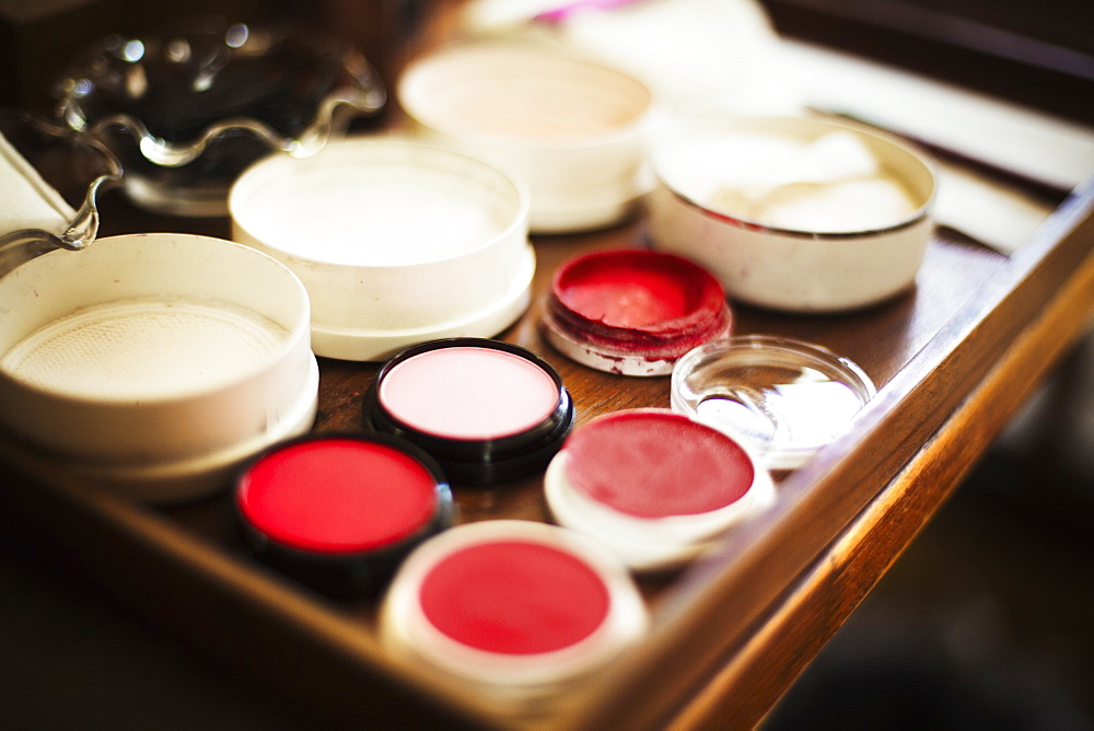 A tray of pots, rice powders, blushers and loose powder used in the white face make up of geisha women, Japan