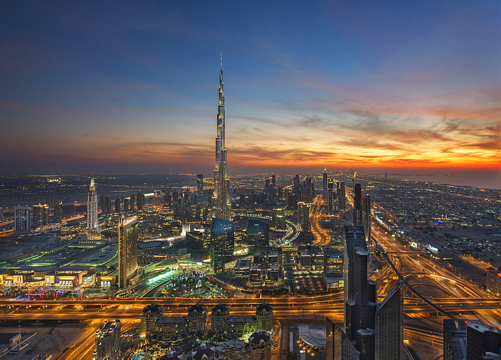 Cityscape of Dubai, United Arab Emirates at dusk, with the Burj Khalifa skyscraper in the distance, Dubai, United Arab Emirates