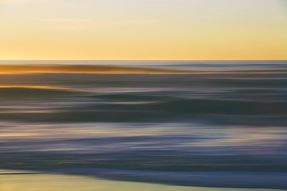 Seascape with cloudy sky at sunset.