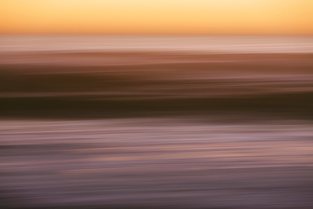 Abstract seascape with horizon over ocean at dusk.