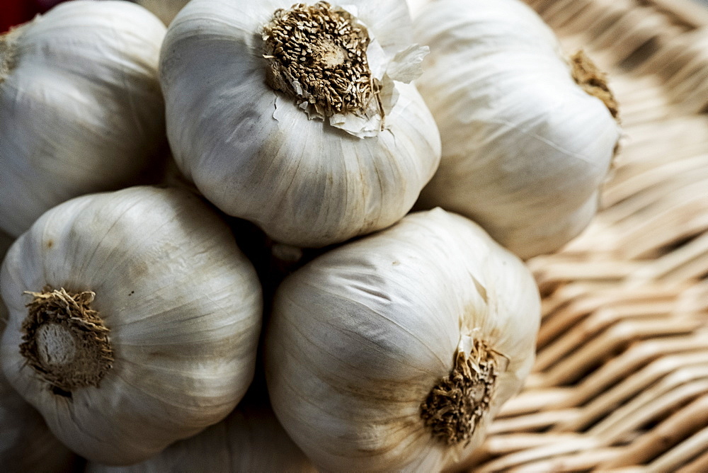 High angle view of a few garlic bulbs in a basket