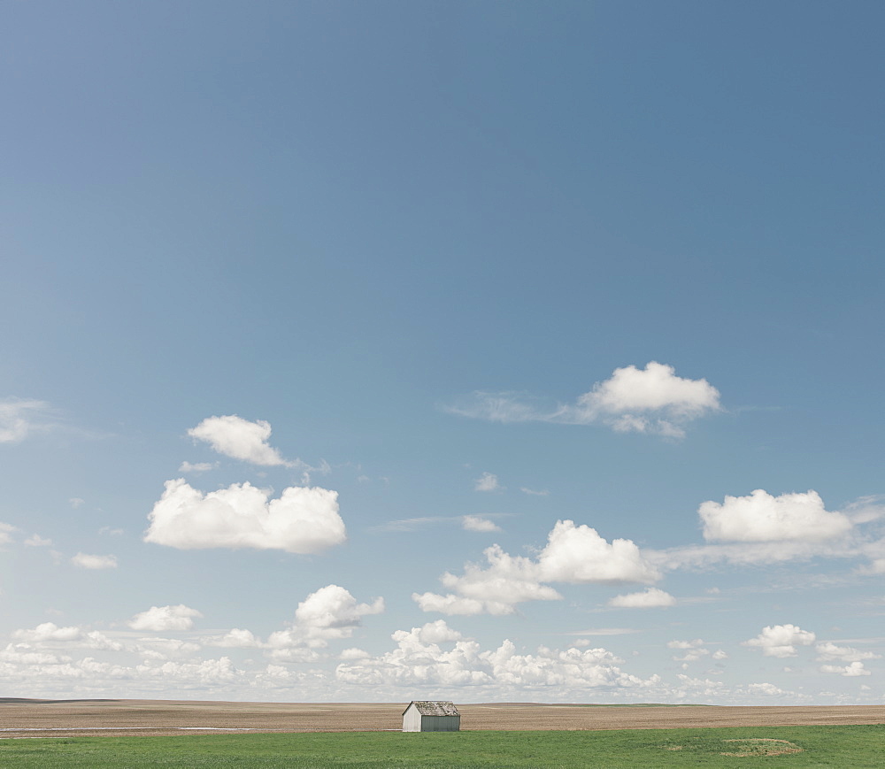 Small barn on vast open prairie, Saskatchewan, Canada