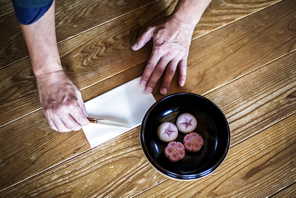 High angle close up of a bowl with Wagashi, a sweet traditionally served during a Japanese Tea Ceremony, Kyushu, Japan