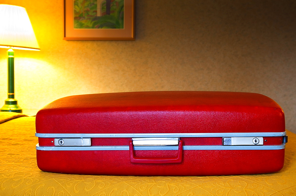 Red Suitcase in Motel Room, Santa Barbara, California, United States of America