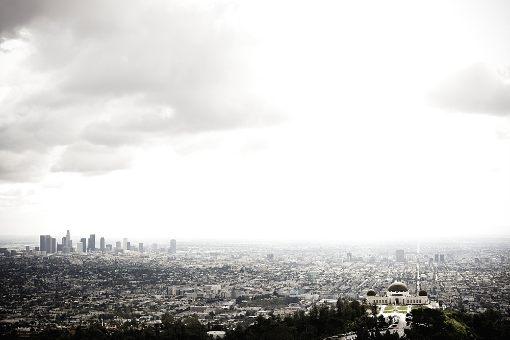 Los Angeles Skyline and Griffith Observatory Beneath Cloudy Sky, Los Angeles, California, United States of America