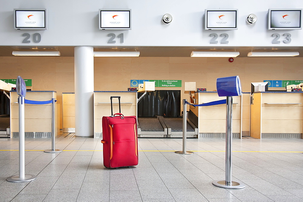 Suitcase at airport check-in counter, Estonia