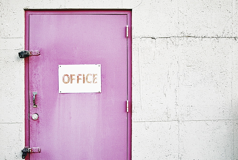 Office sign on locked door, Bradenton, Florida, USA