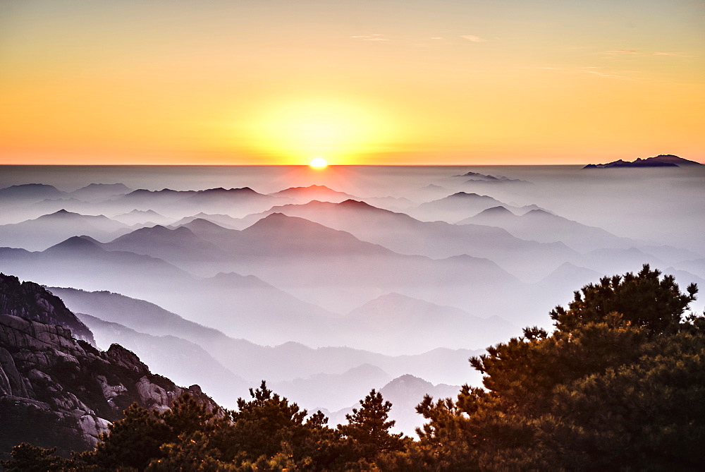 Fog rolling over rocky mountains, Huangshan, Anhui, China, Huangshan, Anhui, China