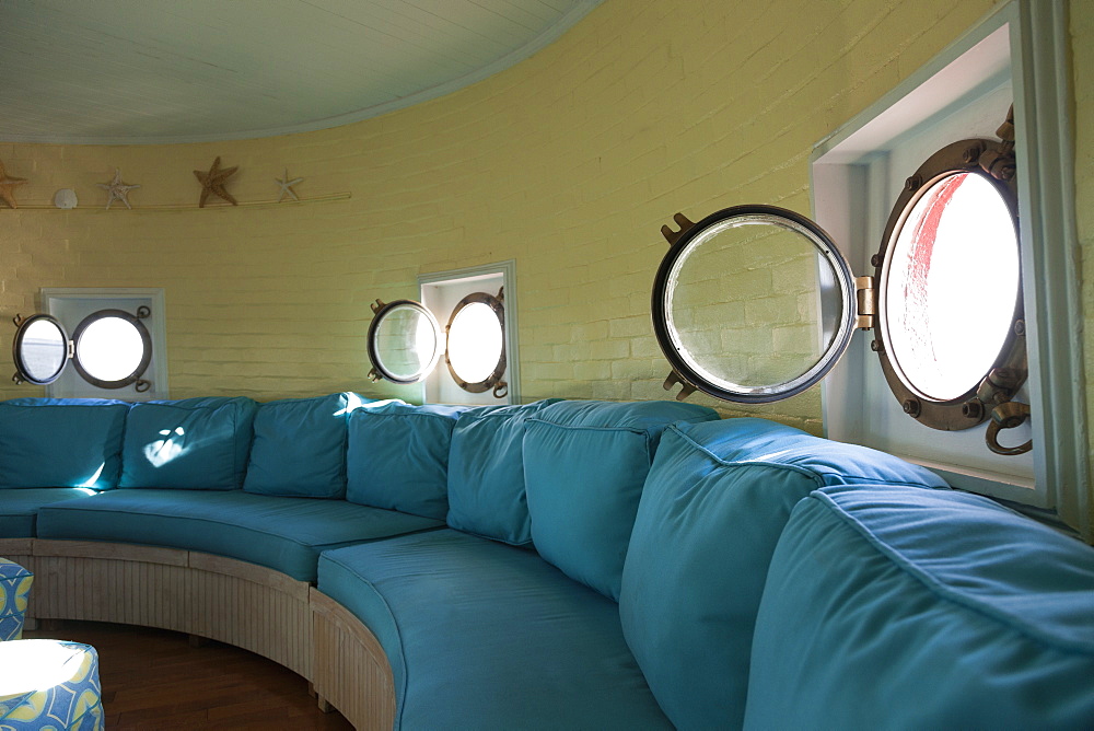 Port hole windows in round lighthouse living room, Newport News, Virginia, USA