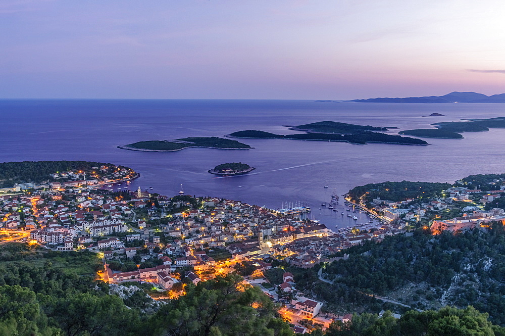Aerial view of coastal town illuminated at night