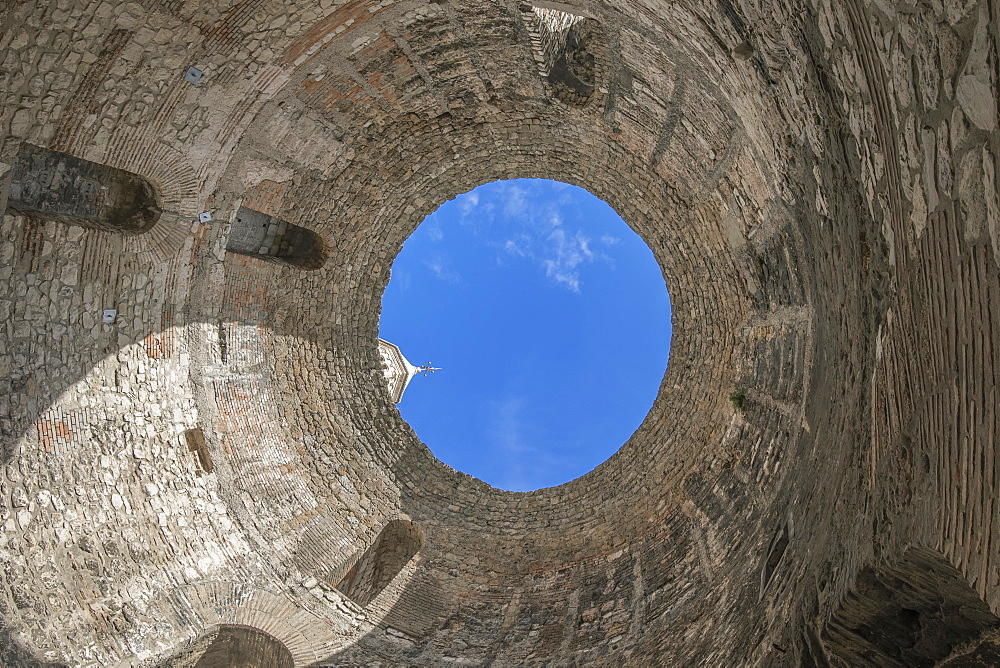 Low angle view of skylight in stone dome