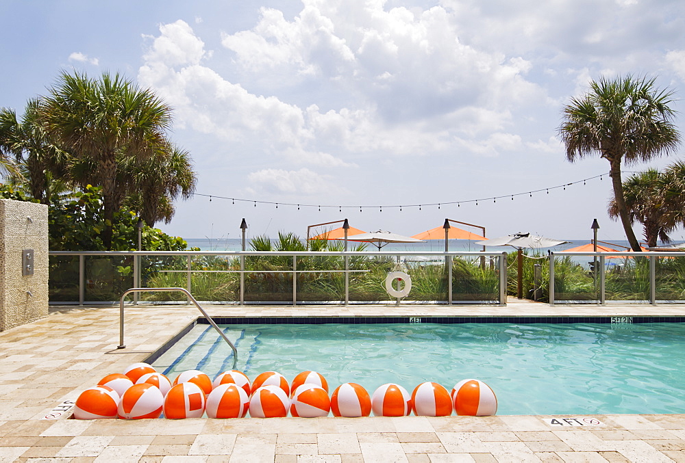 Beach balls in swimming pool, Miami, Florida, USA