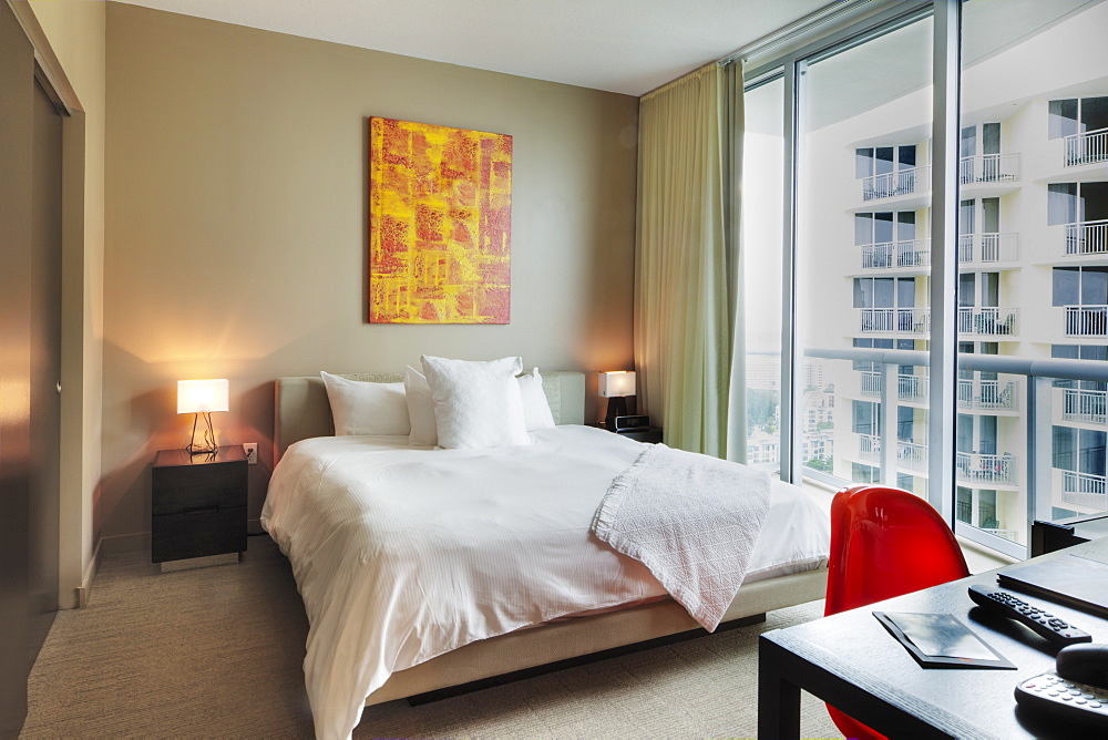 Desk and bed in hotel room, Miami, Florida, USA