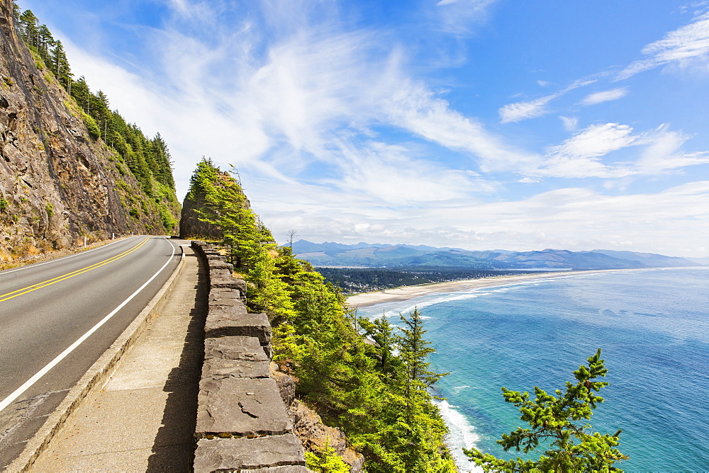 Empty road over beach coastline, Manzanita, Oregon, USA