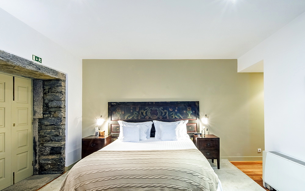 Bed and night tables in hotel room, Peso da Regua, Vila Real, Portugal