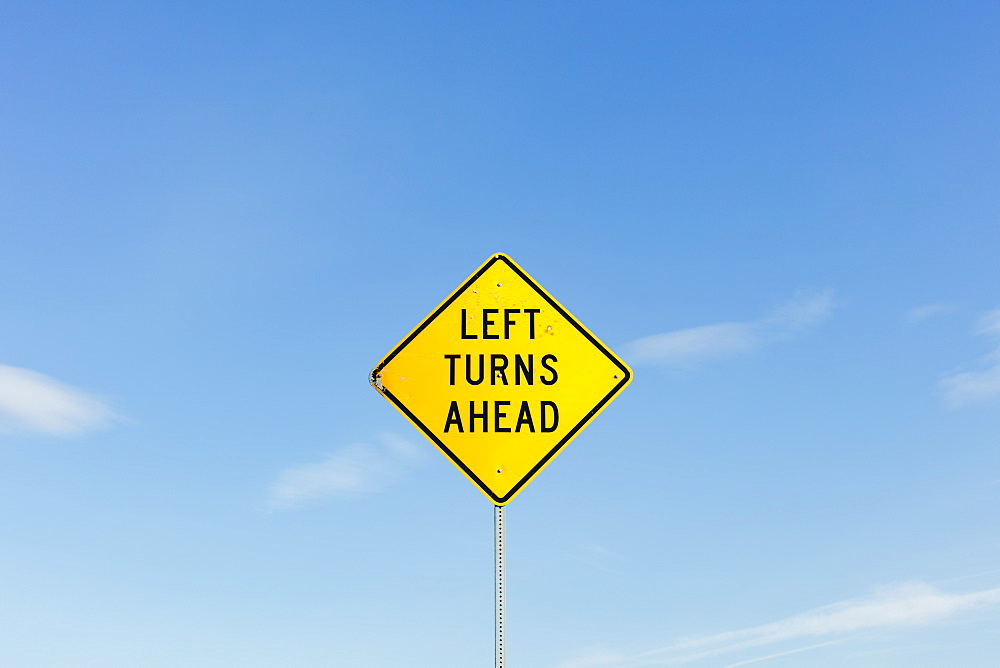 Left Turns Ahead yellow traffic sign, Whitman County, Washington, USA