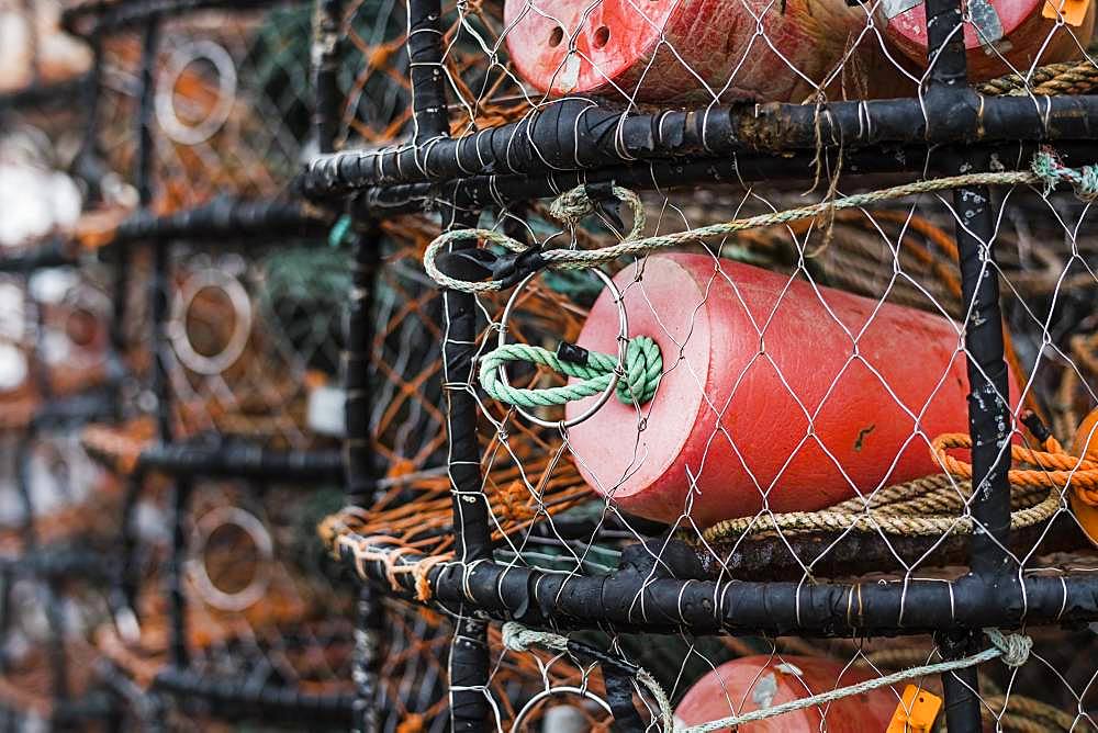 Crab and lobster pots stacked up on the quayside, close up