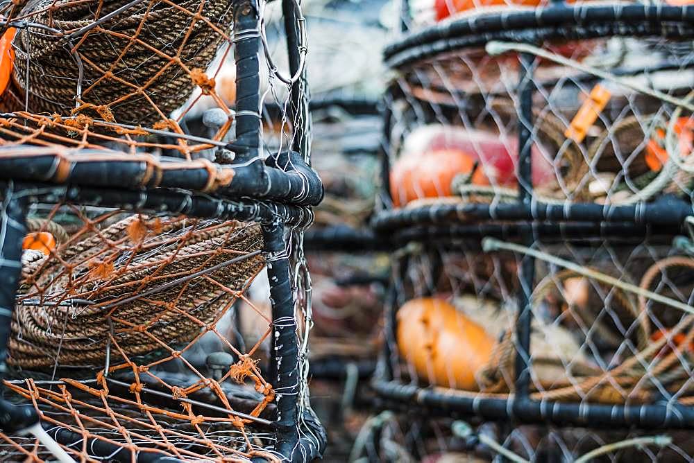 Crab and lobster pots stacked up on the quayside, close up