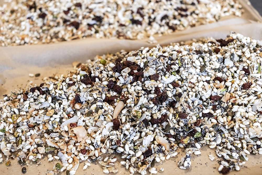 High angle close up of a heap of nuts, raisins and dried fruits