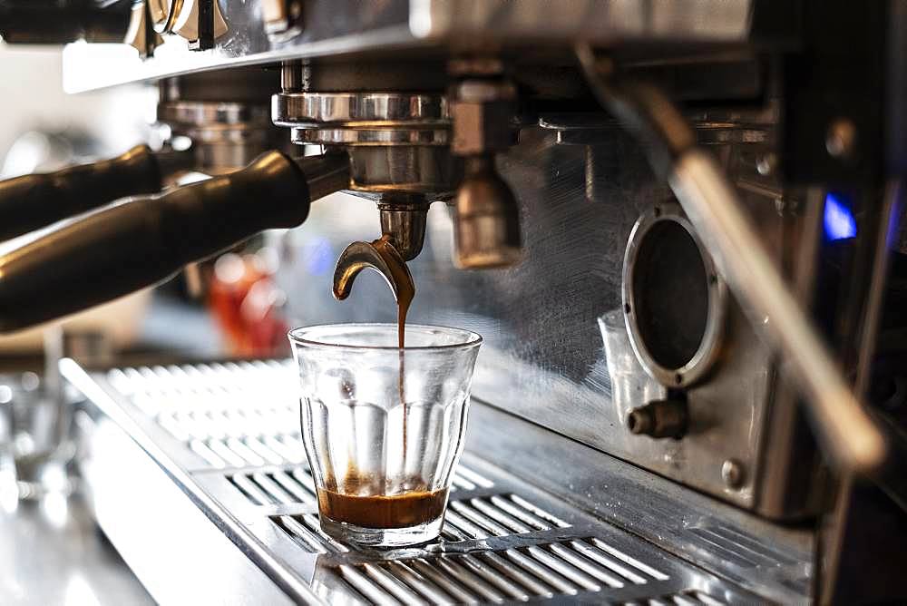 Close up glass on commercial espresso machine