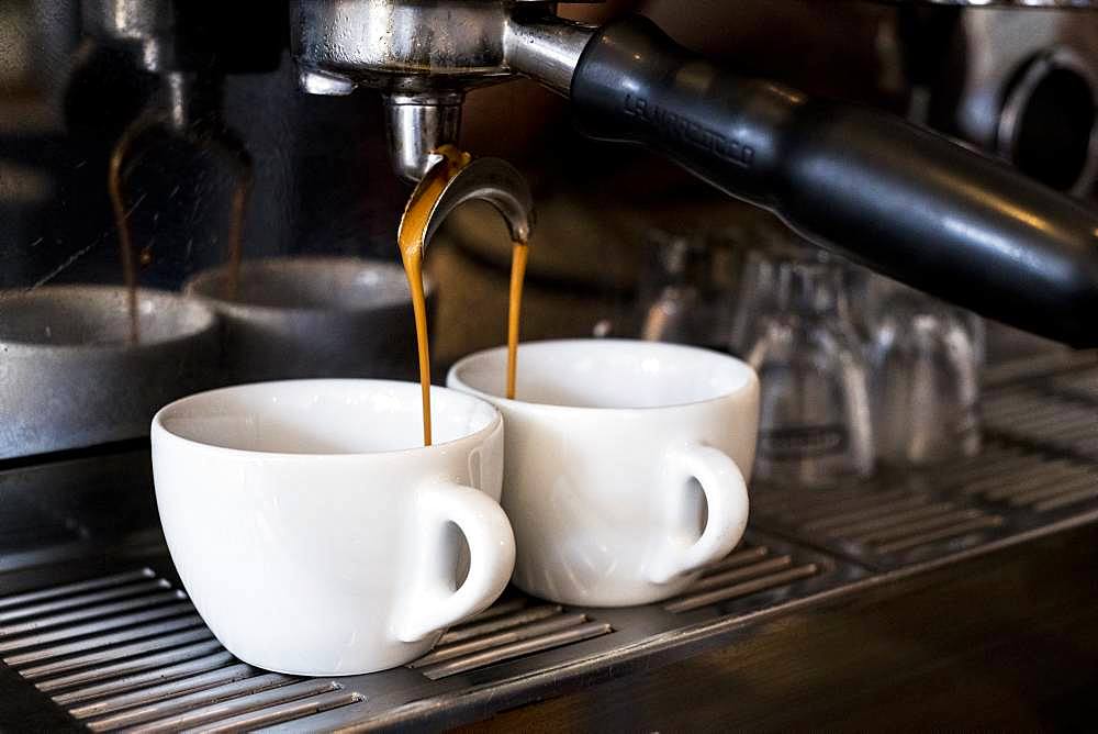 A commercial expresso machine in a coffee shop