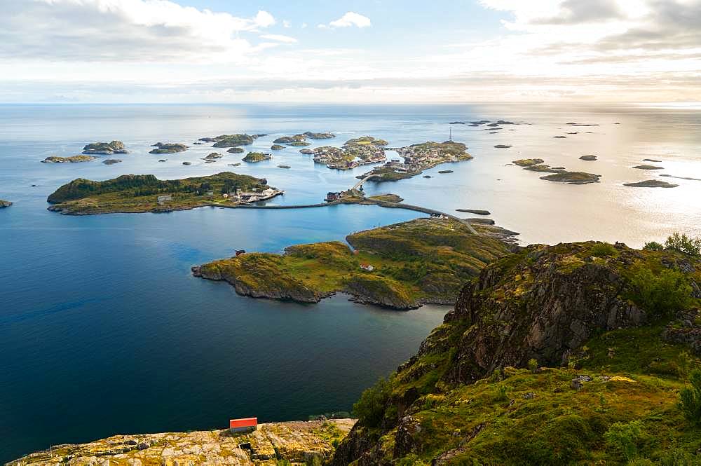 Henningsvaer on Lofoten islands with sheltered harbour and bridges connecting rocky islands, Henningsvaer, Lofoten Islands, Norway