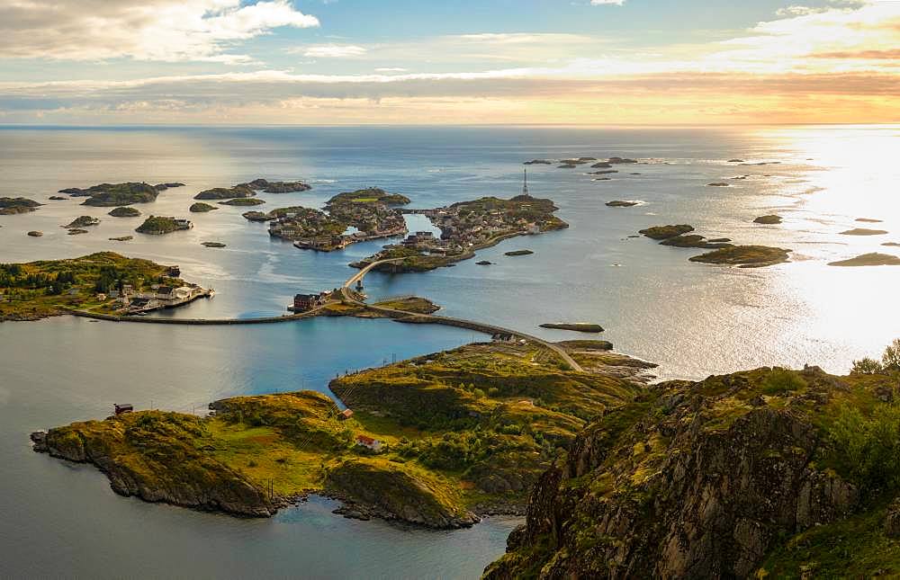 Henningsvaer on Lofoten islands with sheltered harbour and bridges connecting rocky islands, Austvagoy, Lofoten Islands, Norway