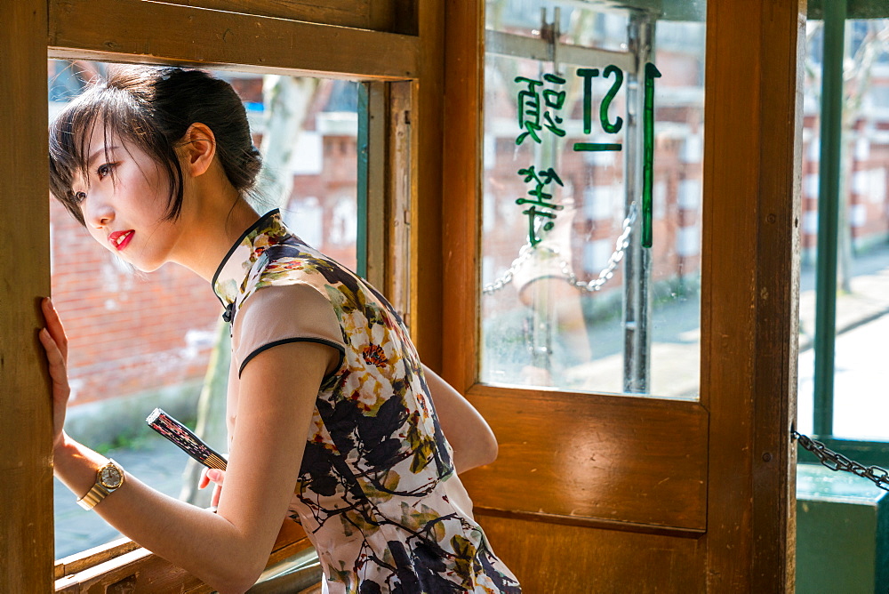 Young Chinese Woman in old tram, Shanghai, China, China