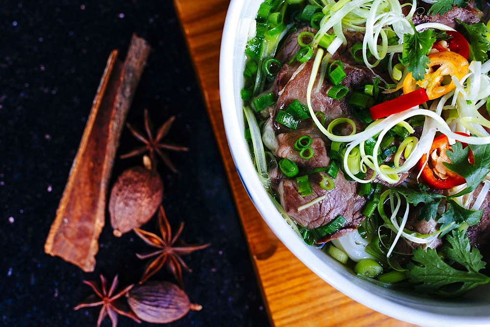 High angle close up of a bowl of beef pho, Vietnam