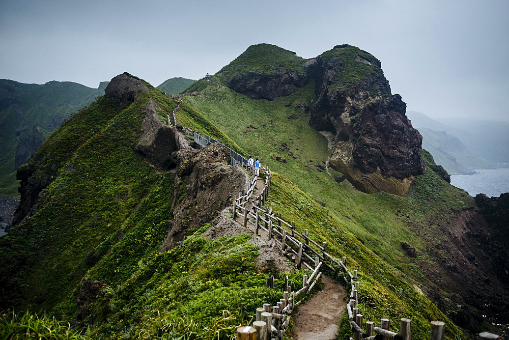 Mountainous landscape with ocean in the distance, Japan
