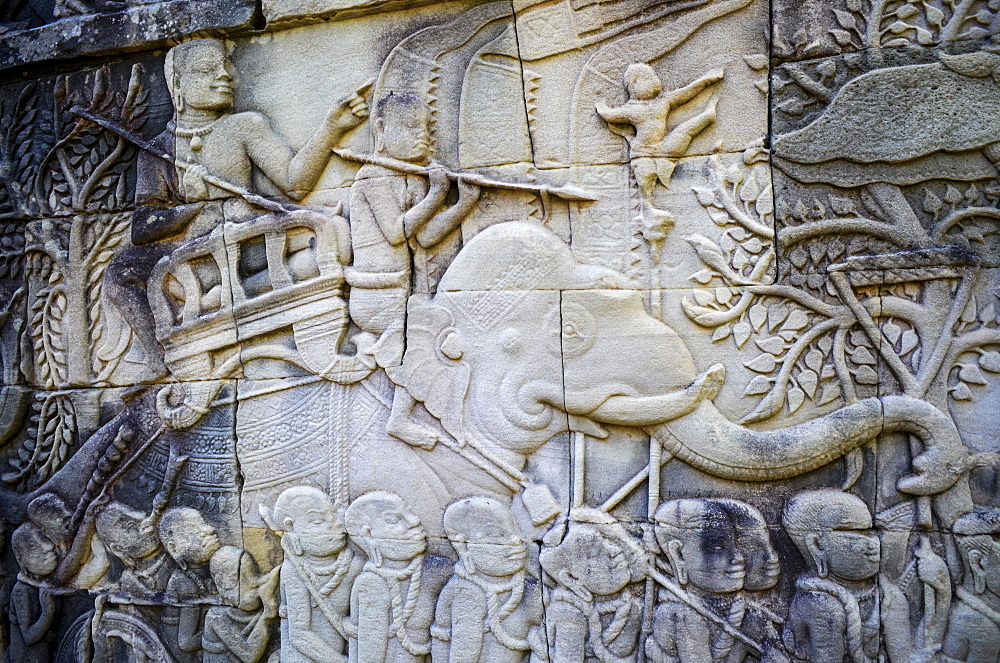 Ankor Wat, a 12th century historic Khmer temple and UNESCO world heritage site. Arches and carved stone bas relief panels with scenes from Khmer cultural history, Angkor Wat, Cambodia