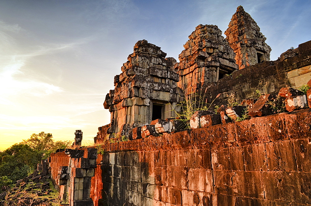 Ankor Wat, a 12th century historic Khmer temple and UNESCO world heritage site. Arches and carved stone blocks and steps at sunset, Angkor Wat, Cambodia