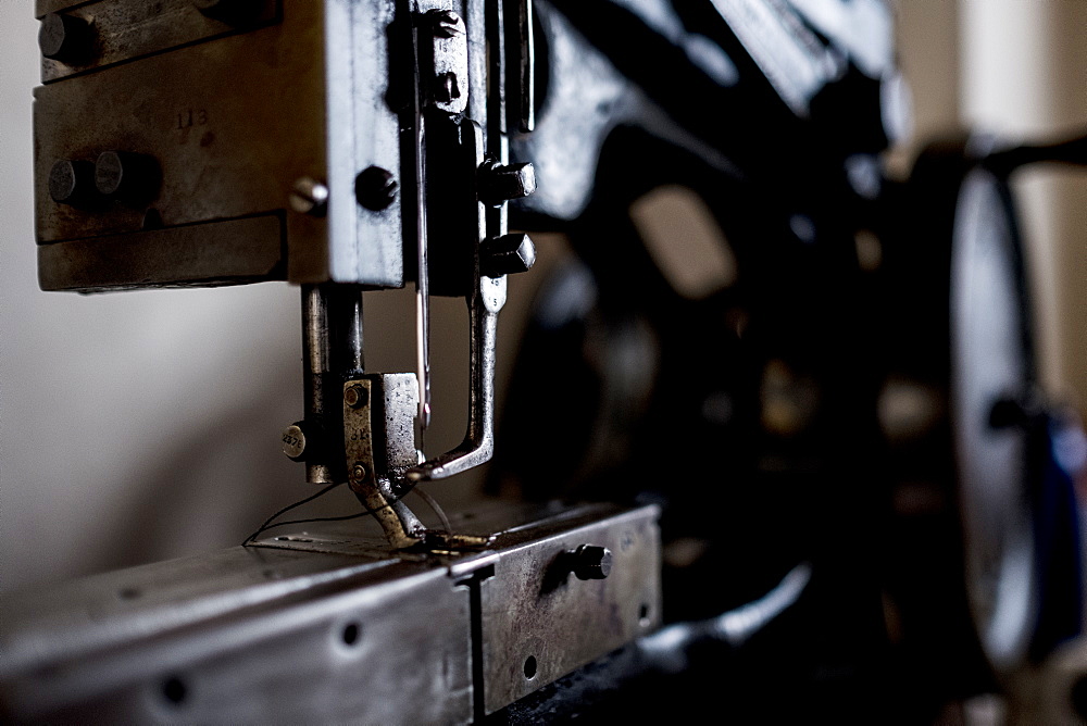 Close up of saddlery sewing machine in a saddler's workshop, Berkshire, United Kingdom