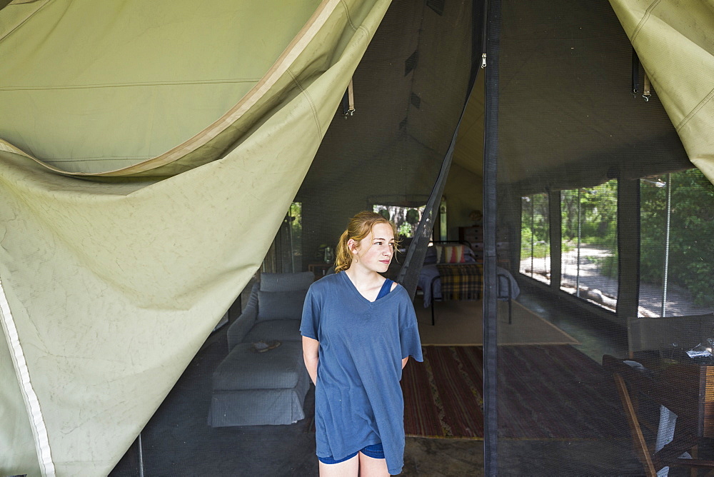 Portrait of Thirteen year old girl outside tented camp, Maun, Botswana