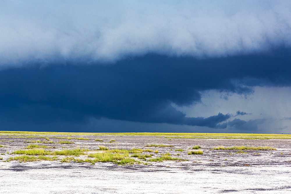 Storm clouds gathering in the sky over the horizon
