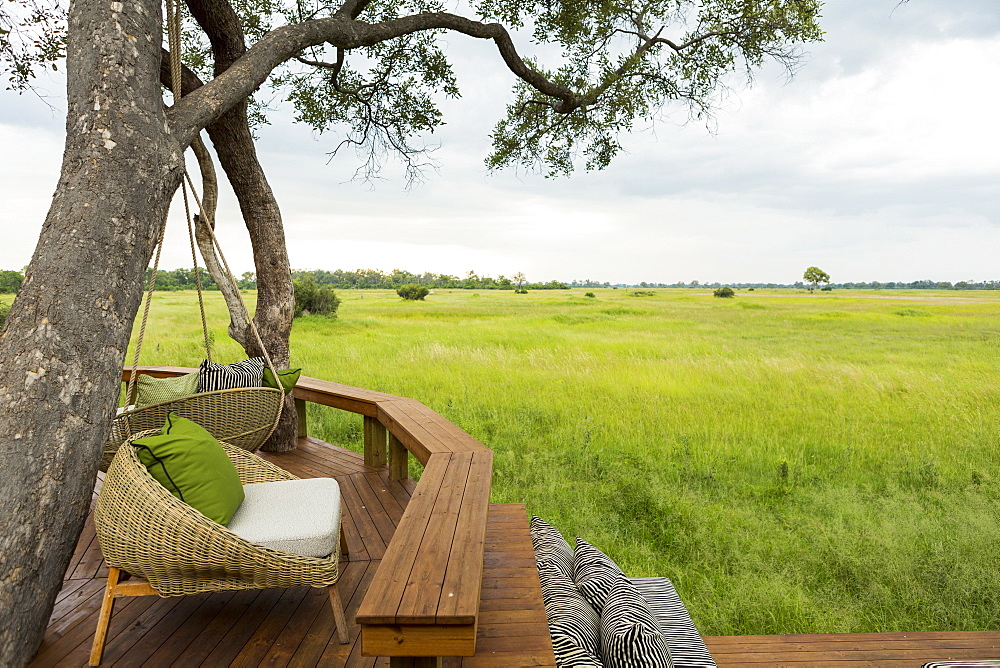 Wooden platform with seats overlooking grassland and landscape