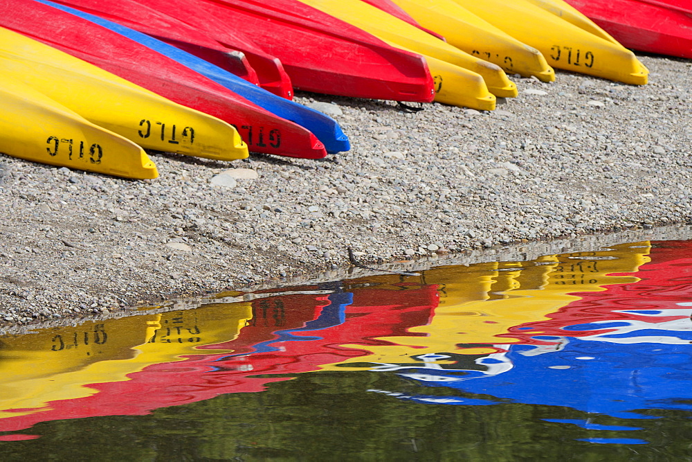 Kayaks for hire, laid out on the shores of Colter Bay at Jackson lake in the Grand Teton National Park, Grand Tetons, Jackson Lake, Wyoming, USA