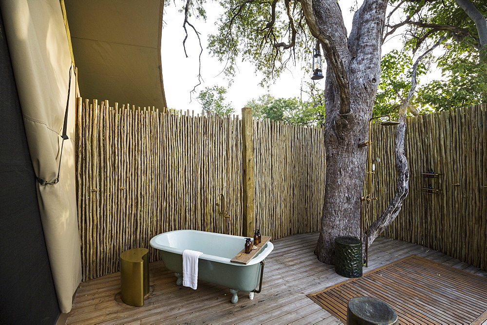 A outdoor bath tub in a tented safari camp, Botswana