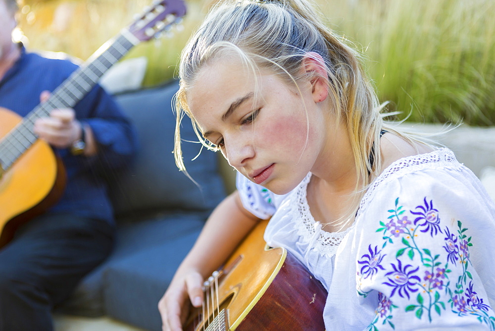 11 year old girl playing guitar