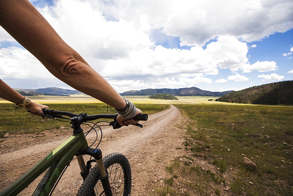 adult woman on mountain bike, New Mexico, United States