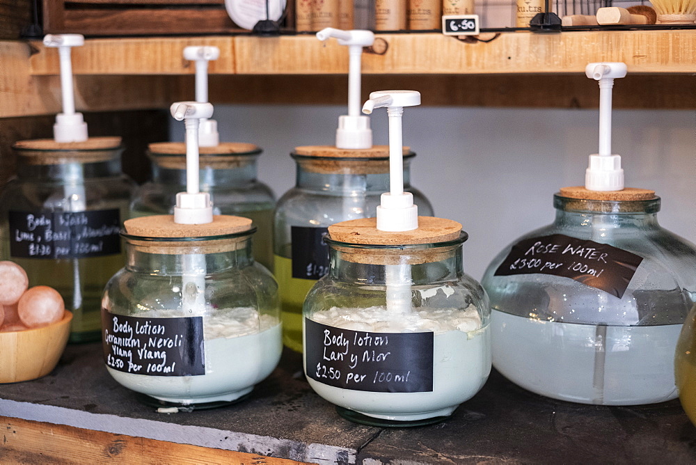 Close up of glass jar dispensers of beauty products in a waste free wholefood store, Watlington, Oxfordshire, United Kingdom