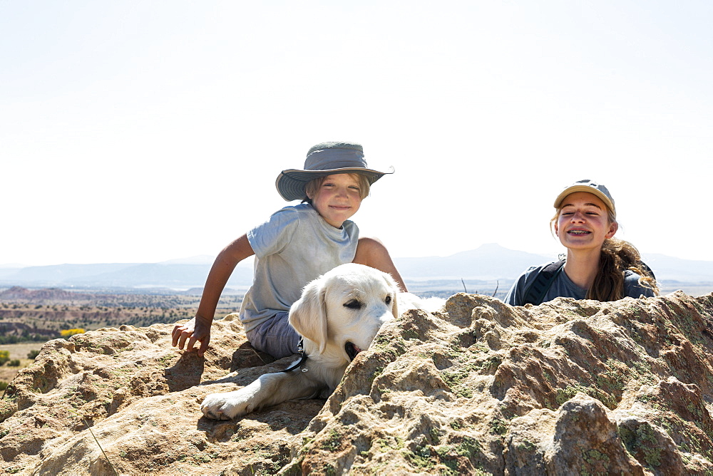 young boy and his teen sister with their dog, New Mexico, United States of America