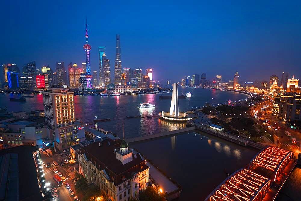 Skyline of the Pudong Financial district across Huangpu River at dusk, Shanghai, China, China
